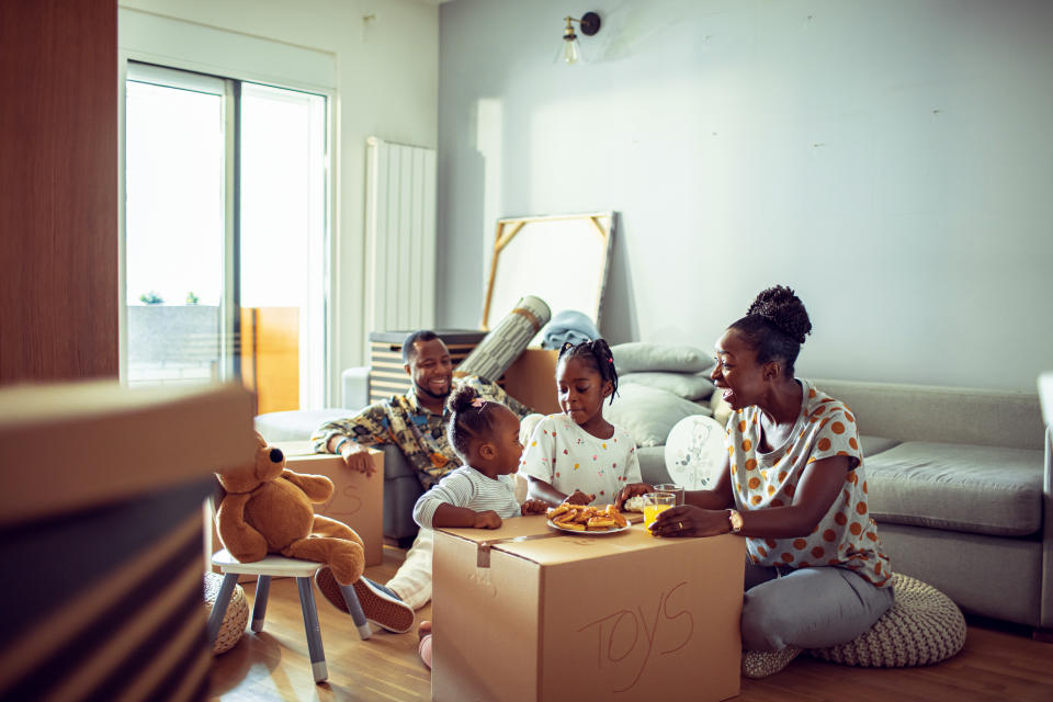 Close up of a young family having breakfast in their new home