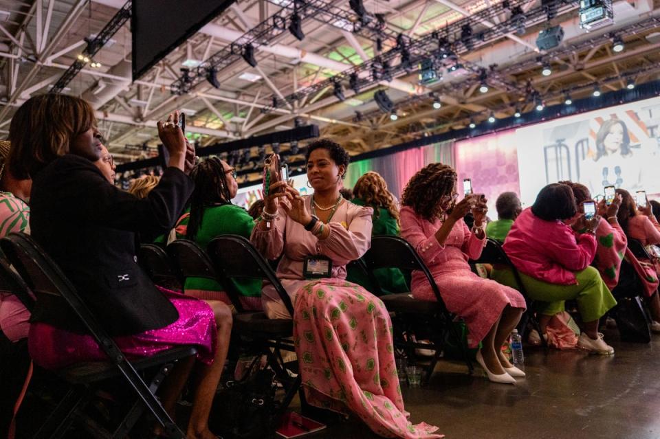 Members of the Alpha Kappa Alpha Sorority take photos as Harris, one of their own, spoke to 20,000 members earlier this month in Dallas, Texas (Getty Images)