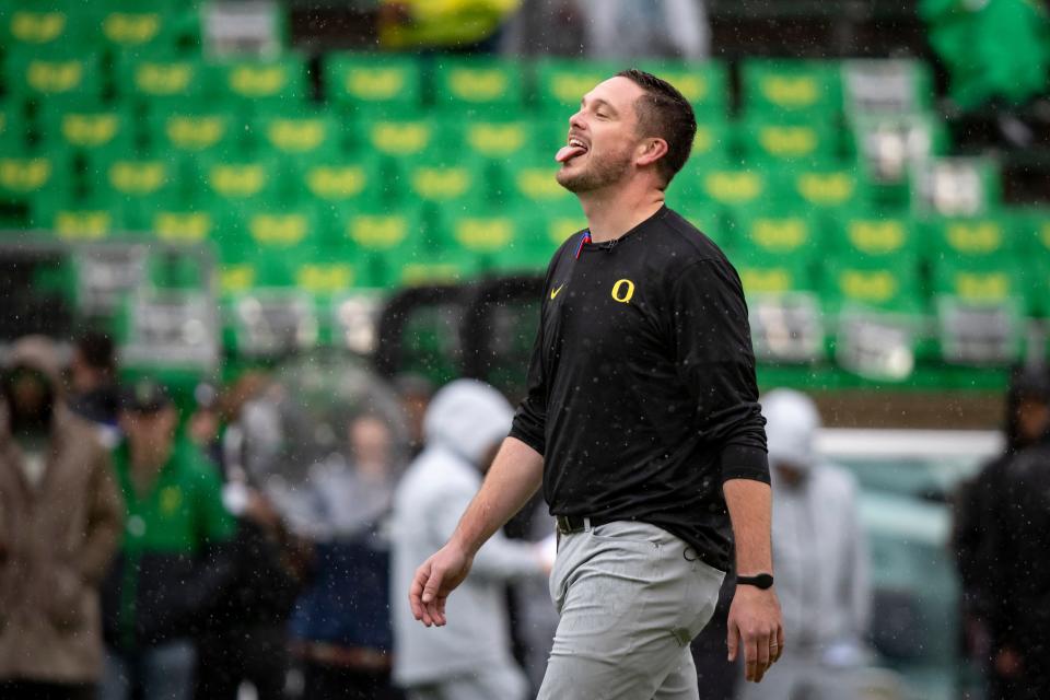 Oregon head coach Dan Lanning sticks his tongue out to catch the rain as the No. 6 Oregon Ducks host California Nov. 4.