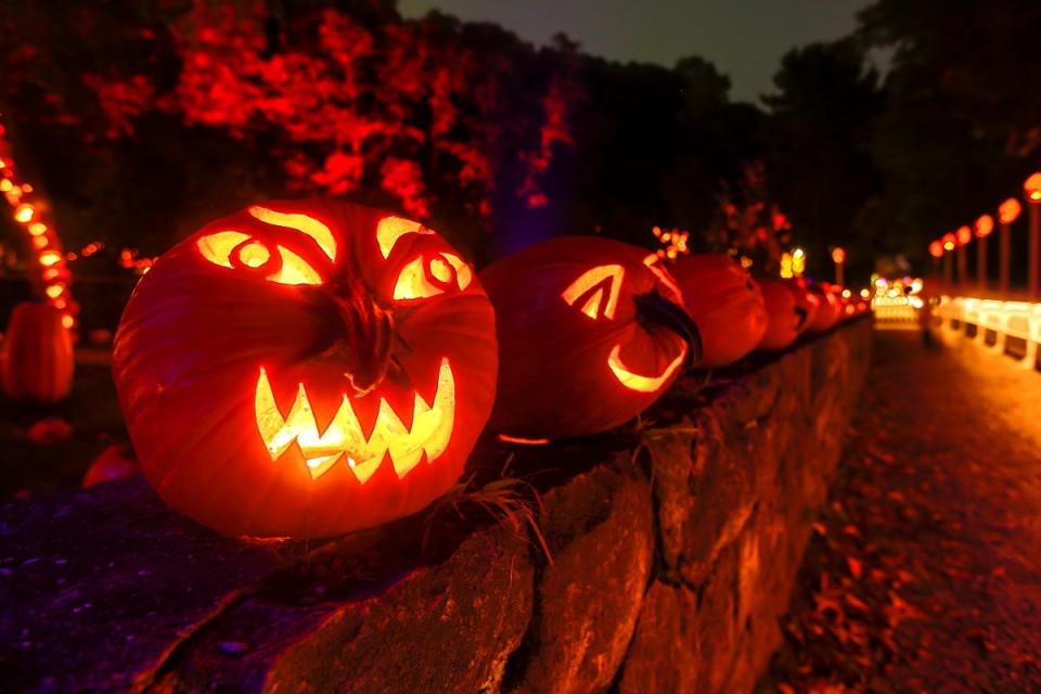 Carved pumpkins glowing in the dark