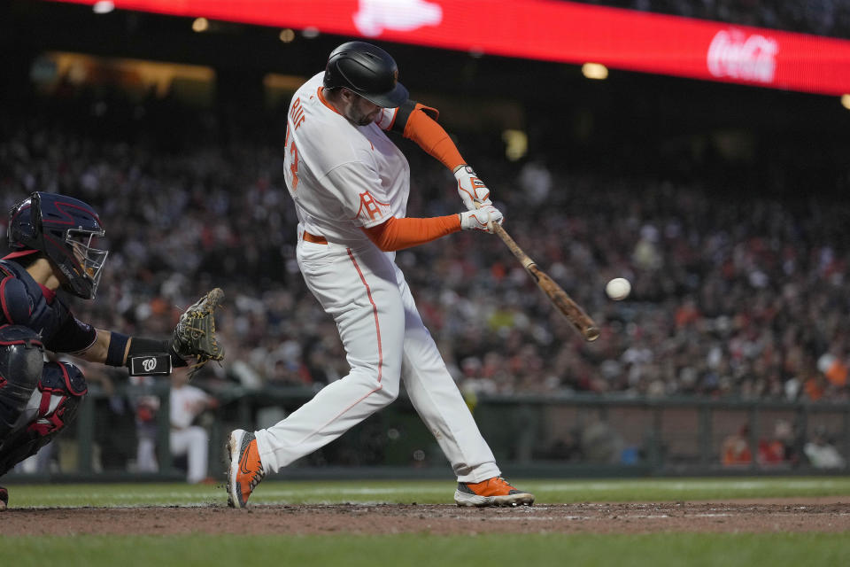 San Francisco Giants' Darin Ruf (33) hits a solo home run against the Washington Nationals during the fifth inning of a baseball game Friday, July 9, 2021, in San Francisco. (AP Photo/Tony Avelar)