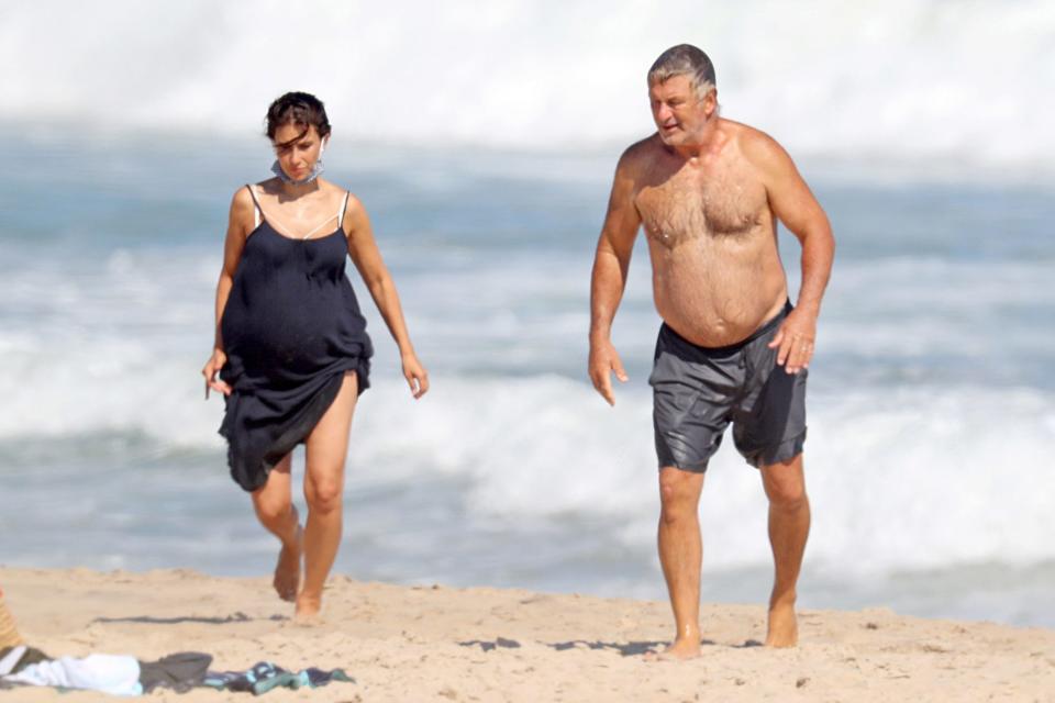 <p>Alec and Hilara Baldwin make their way back to the sand during a visit to the beach in The Hamptons, New York, on Thursday.</p>