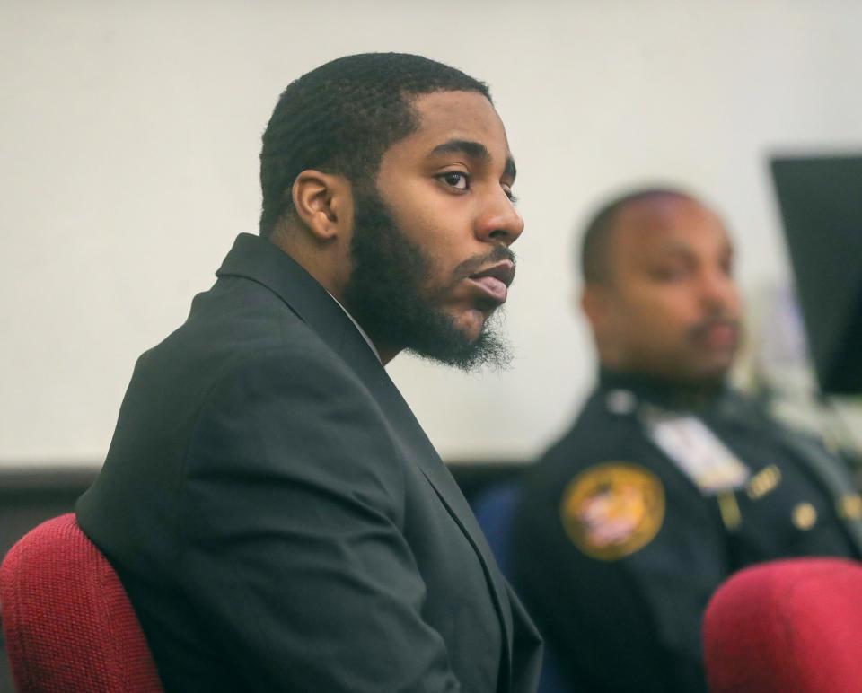 Kashmair Mingo listens during his trial in November in Summit County Common Pleas Court. He was convicted of murder and other charges and recently was sentenced to life in prison.