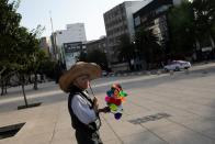 A street vendor is seen on the street after Mexico's government declared a health emergency on Monday and issued stricter rules aimed at containing the fast-spreading coronavirus disease (COVID-19), in Mexico City