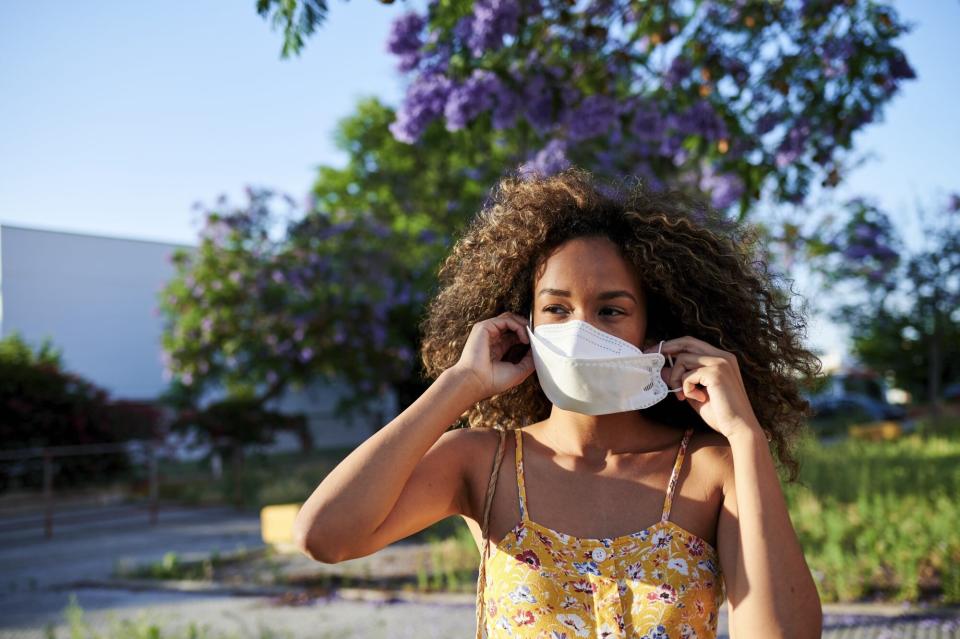 woman wearing antiviral mask