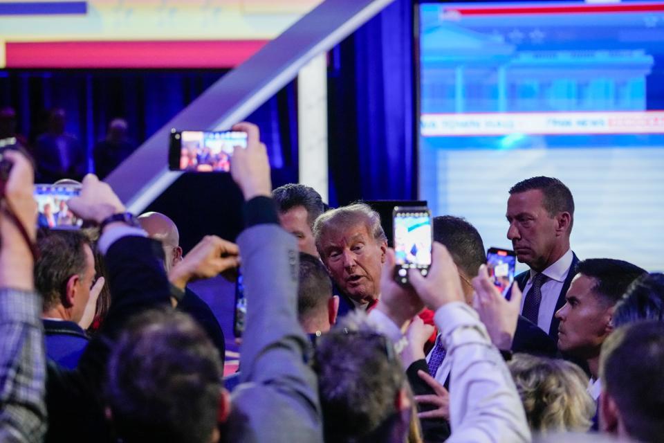 President Donald Trump takes photos with fans at the Iowa Events Center on Wednesday, Jan. 10, 2024, in Des Moines, IA.