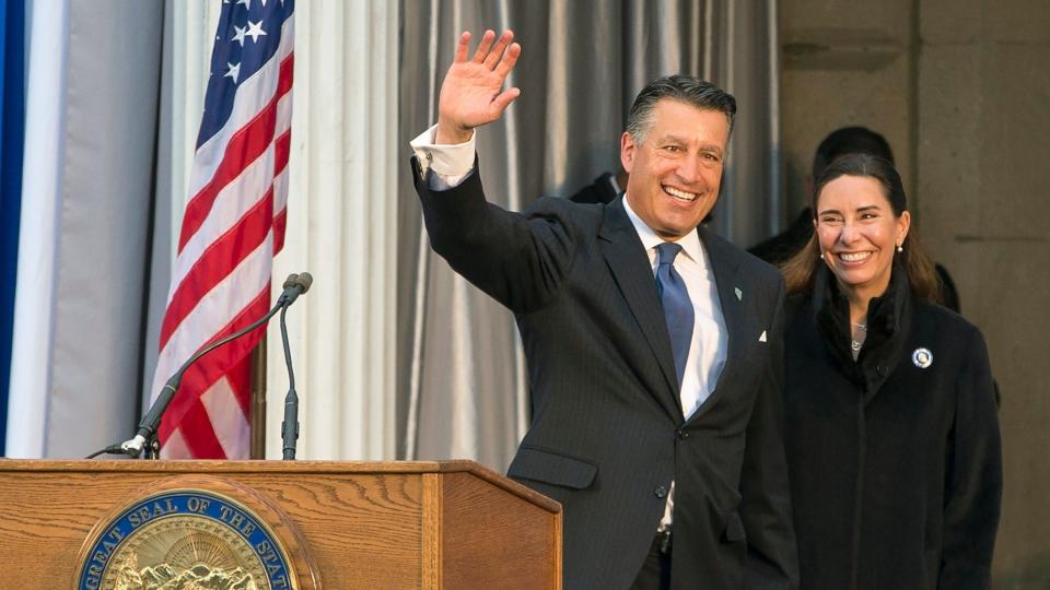 Mandatory Credit: Photo by Tom R Smedes/AP/Shutterstock (10780814a)Governor Brian Sandoval, with wife Lauralyn McCarthy, gives one last wave as governor before Governor-elect Steve Sisolak is sworn into office on the steps of the Nevada State Capitol in Carson City, Nev.