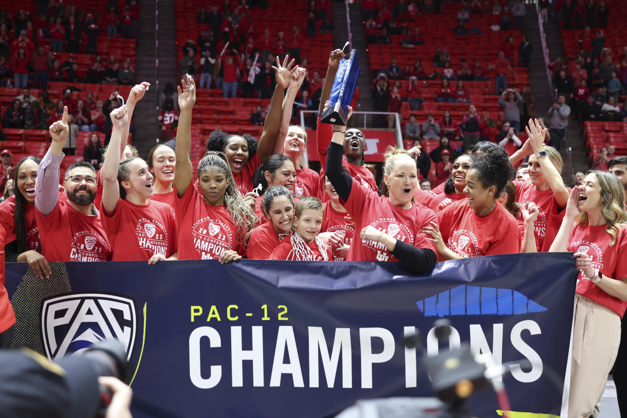 Utah players and coaches celebrate being named Pac-12 co-champions after beating Stanford on Feb. 25, 2023, in Salt Lake City. (AP Photo/Rob Gray)