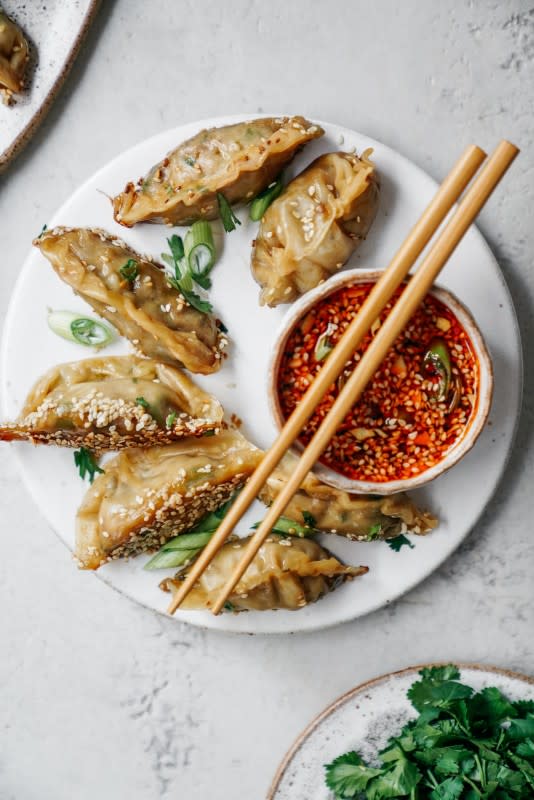 <p>Food by Maria</p><p>This super easy vegan dumplings recipe goes so well with my sesame chili dipping sauce. Your whole family will love making and eating them!</p><p><strong>Get the recipe: <a href="https://www.foodbymaria.com/2019/02/23/vegan-potstickers-with-sesame-chilli-dipping-sauce/" rel="nofollow noopener" target="_blank" data-ylk="slk:Vegan Potstickers with Sesame Chilli Dipping Sauce;elm:context_link;itc:0;sec:content-canvas" class="link rapid-noclick-resp"><em>Vegan Potstickers with Sesame Chilli Dipping Sauce</em></a></strong></p>
