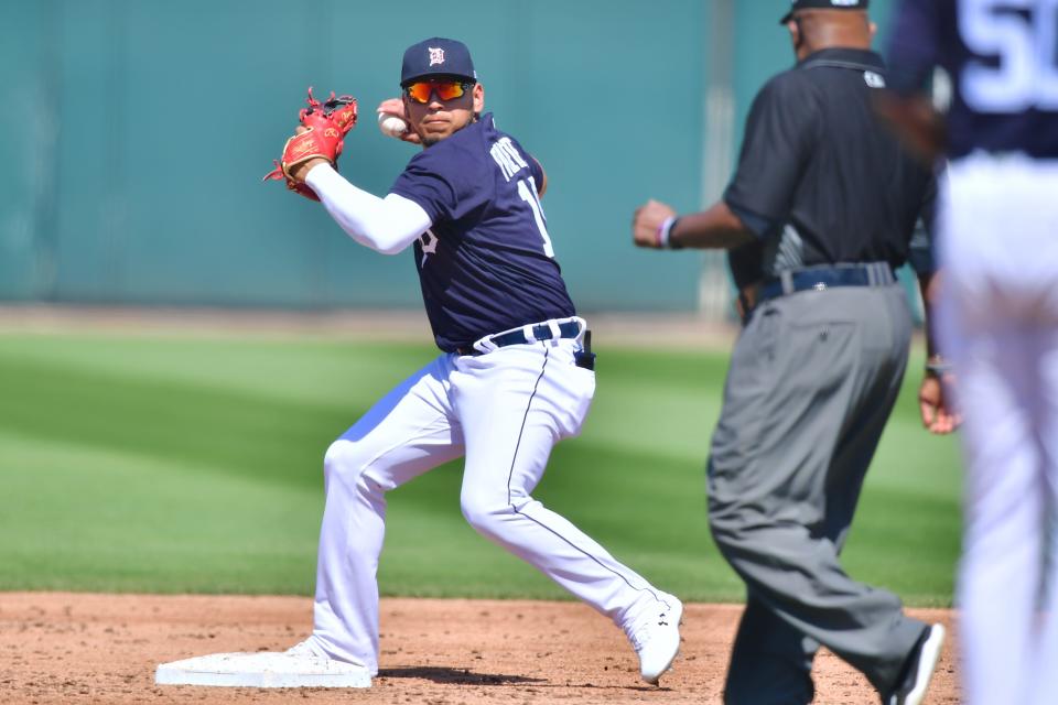 Isaac Paredes of the Detroit Tigers turns a double play in the third inning against the New York Yankees during a spring training game on March 12, 2021, at Joker Marchant Stadium in Lakeland, Florida.