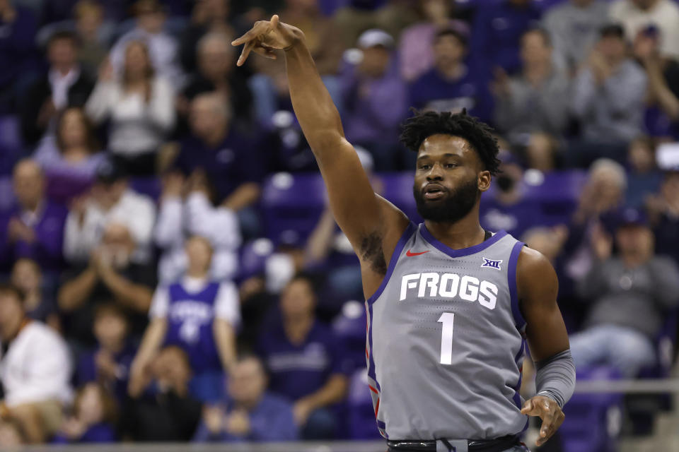 TCU guard Mike Miles Jr. (1) reacts after making a three point basket against Iowa State during the first half of an NCAA college basketball game, Saturday, Jan. 7, 2023, in Fort Worth, Texas. (AP Photo/Ron Jenkins)