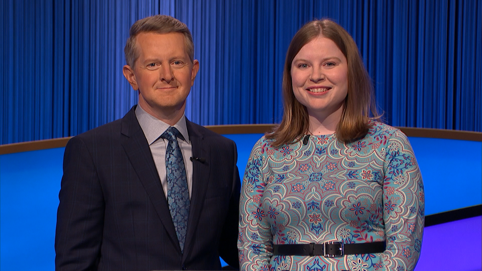Adriana Harmeyer stands with Jeopardy! host Ken Jennings following her earned title of Jeopardy! champion.