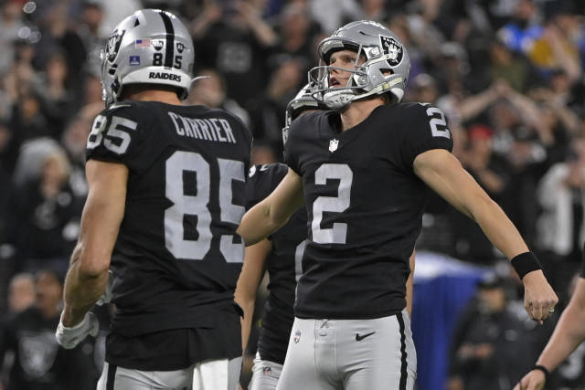 Las Vegas Raiders place kicker Daniel Carlson (2) after kicking field goal  during an NFL football game against the Seattle Seahawks, Sunday, Nov. 27,  2022, in Seattle, WA. The Raiders defeated the