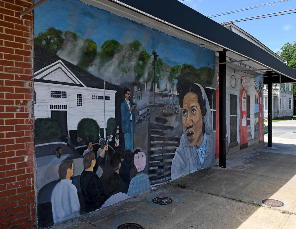 A mural of Gloria Richardson, remembering the fires that burned down much of Pine Street in Cambridge, Maryland after she left.