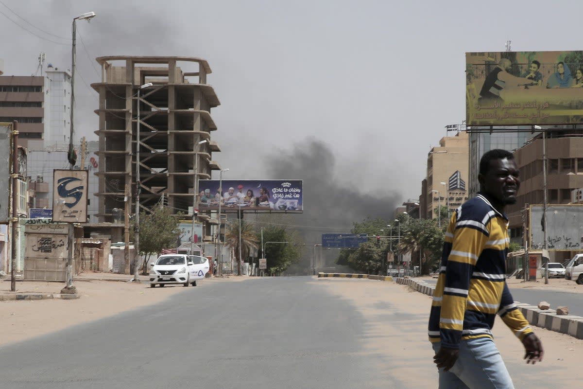 Smoke is seen rising in Khartoum as the power struggle between Sudan’s military and the country’s powerful paramilitary continues (AP)