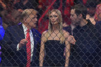 Former President Donald Trump, left, talks to his daughter Ivanka Trump and son-in-law Jared Kushner as they wait for the start of a UFC 299 mixed martial arts bout, early Sunday, March 10, 2024, in Miami. (AP Photo/Wilfredo Lee)