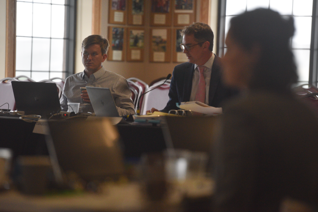 Brian Jorde, right, looks down at his notes on Saturday, Aug. 5, 2023. South Dakota Public Utilities Commission analyst Jon Thurber said he would withhold any recommendation on whether to approve or deny a permit for Navigator's Heartland Greenway pipeline system when asked by Jorde.