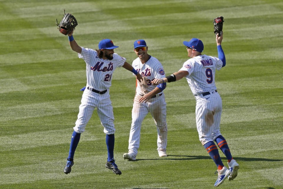 New York Mets center fielder Billy Hamilton (21), left fielder Michael Conforto (30) and left fielder Brandon Nimmo (9) celebrate after they defeated the Miami Marlins in a baseball game at Citi Field, Sunday, Aug. 9, 2020, in New York. (AP Photo/Kathy Willens)