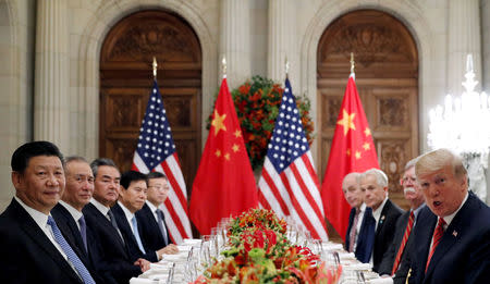 FILE PHOTO: FILE PHOTO: U.S. President Donald Trump, U.S. Secretary of State Mike Pompeo, U.S. President Donald Trump's national security adviser John Bolton and Chinese President Xi Jinping attend a working dinner after the G20 leaders summit in Buenos Aires, Argentina December 1, 2018. REUTERS/Kevin Lamarque/File Photo/File Photo