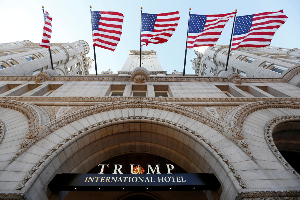 Flags fly above the entrance to the new Trump International Hotel on its opening day in Washington, DC, U.S. September 12, 2016. REUTERS/Kevin Lamarque/File Photo