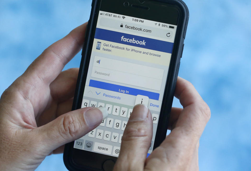 CORRECTING DATE OF ANNOUNCEMENT TO WEDNESDAY - FILE - In this file photo dated Tuesday, Aug. 21, 2018, a Facebook start page is shown on a smartphone in Surfside, Fla. USA.  The social media giant Facebook said late Wednesday Aug. 22, 2018, it has banned a quiz app for refusing to be audited and concerns that data on as many as 4 million users was misused, after it found user information was shared with researchers and companies. (AP Photo/Wilfredo Lee, FILE)