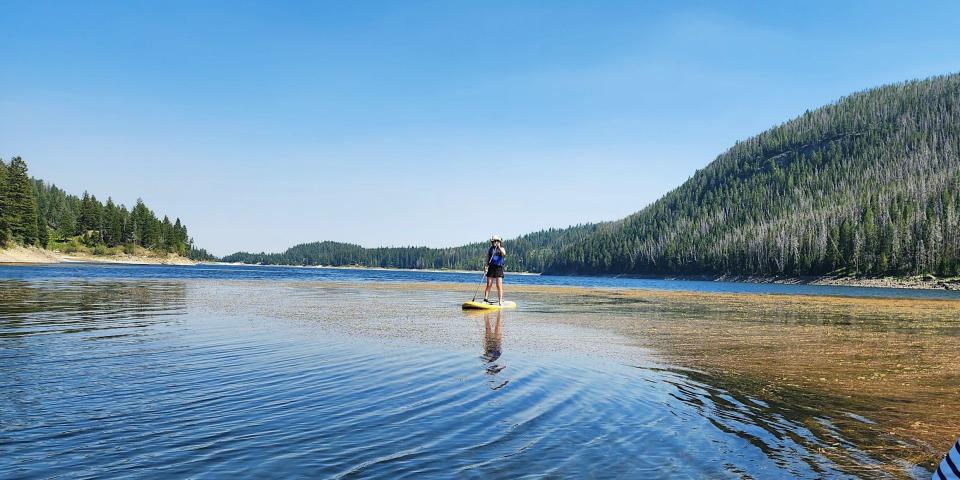 The author on a stand-up paddle board on Rock Creek Lake in Montana