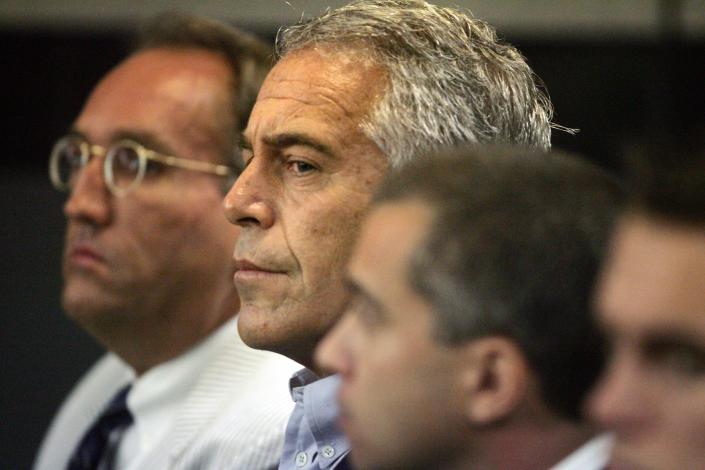 After Jeffrey Epstein, center, made a deal with prosecutors in 2008 in West Palm Beach, Fla., the wealthy financier and convicted sex offender was arrested in New York on sex trafficking charges.