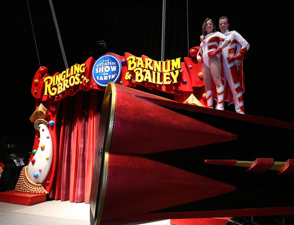 <p>Tina and Brian Miser stand atop their double-barreled cannon, Aug. 10, 2006, at the Fort Worth Convention Center in Fort Worth, Texas. The husband and wife team are human cannonballs for the Ringling Bros. Barnum & Bailey Circus. (AP Photo/D.J. Peters) </p>