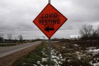 FILE PHOTO: A sign for a COVID-19 drive-thru testing site alongside US Highway 12 is seen as the coronavirus disease (COVID-19) outbreak continues in Eau Claire