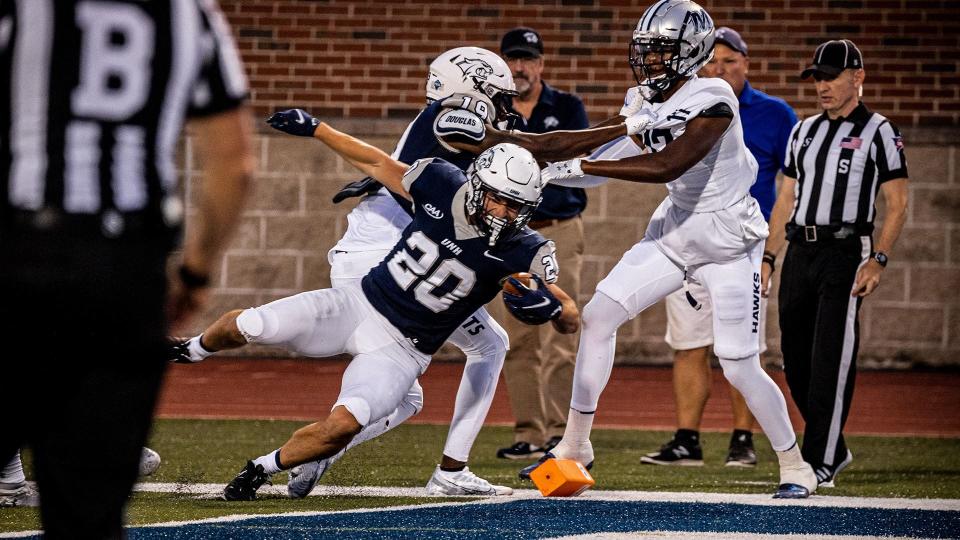 Dylan Laube scores one of his two touchdowns for the University of New Hampshire football team during a 31-21 win over Monmouth to open the season Thursday, Sept. 1, 2022 at Wildcat Stadium in Durham.
