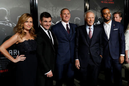 Director Clint Eastwood (2nd R) poses with cast members (L-R) Jenna Fischer, Alek Skarlatos, Spencer Stone and Anthony Sadler at a premiere for "The 15:17 to Paris" in Burbank, California, U.S., February 5, 2018. REUTERS/Mario Anzuoni