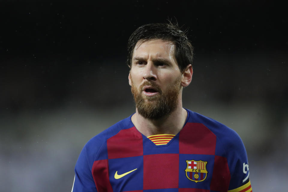 Barcelona's Lionel Messi attends the Spanish La Liga soccer match between Real Madrid and Barcelona at the Santiago Bernabeu stadium in Madrid, Spain, Sunday, March 1, 2020. (AP Photo/Manu Fernandez)