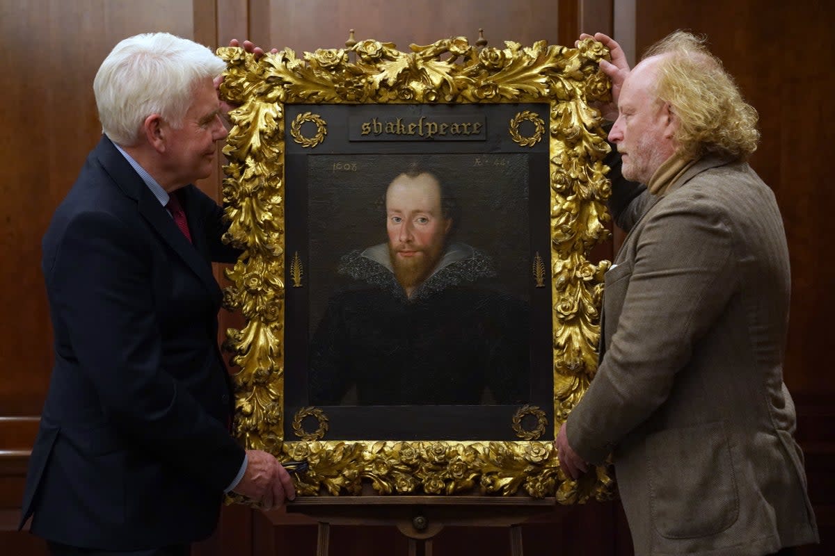 Conservator Adrian Phippen (right) and art and antiques writer Duncan Phillipps with a portrait said to be of William Shakespeare by artist Robert Peake (Kirsty O’Connor/PA) (PA Wire)