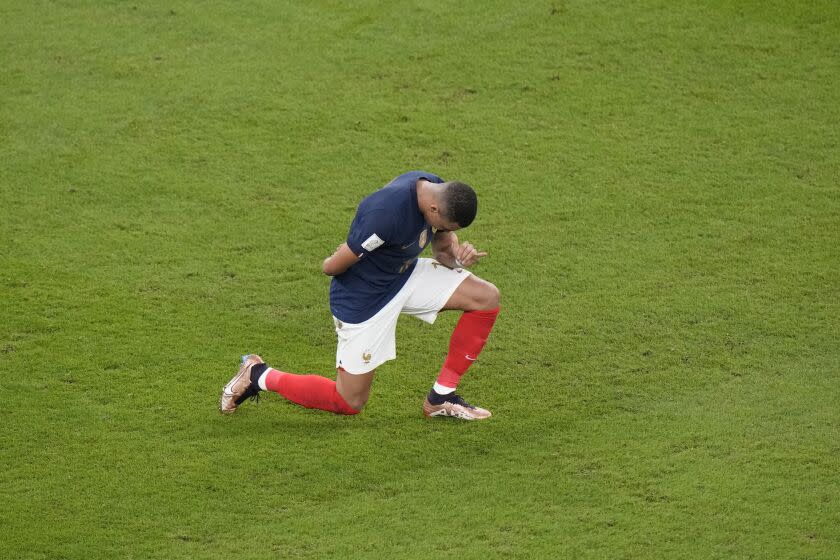 France's Kylian Mbappe celebrates after scoring during the World Cup round of 16 soccer match between France and Poland, at the Al Thumama Stadium in Doha, Qatar, Sunday, Dec. 4, 2022. (AP Photo/Luca Bruno)