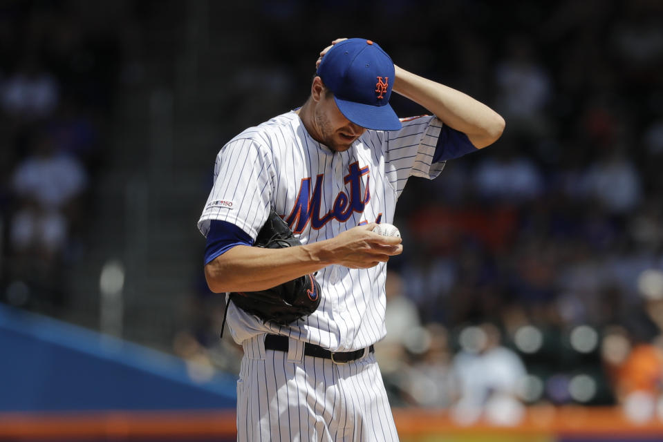 New York Mets starting pitcher Jacob deGrom reacts during the first inning of a baseball game against the Washington Nationals, Sunday, Aug. 11, 2019, in New York. (AP Photo/Frank Franklin II)