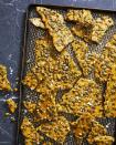 <p>These crunchy, sweet treats sprinkled with flaky salt might just outshine the Halloween candy.</p><p>Get the <a href="https://www.countryliving.com/food-drinks/a33944366/rosemary-pumpkin-seed-brittle/" rel="nofollow noopener" target="_blank" data-ylk="slk:Rosemary-Pumpkin Seed Brittle recipe;elm:context_link;itc:0;sec:content-canvas" class="link "><strong>Rosemary-Pumpkin Seed Brittle recipe</strong></a> from Country Living.</p>