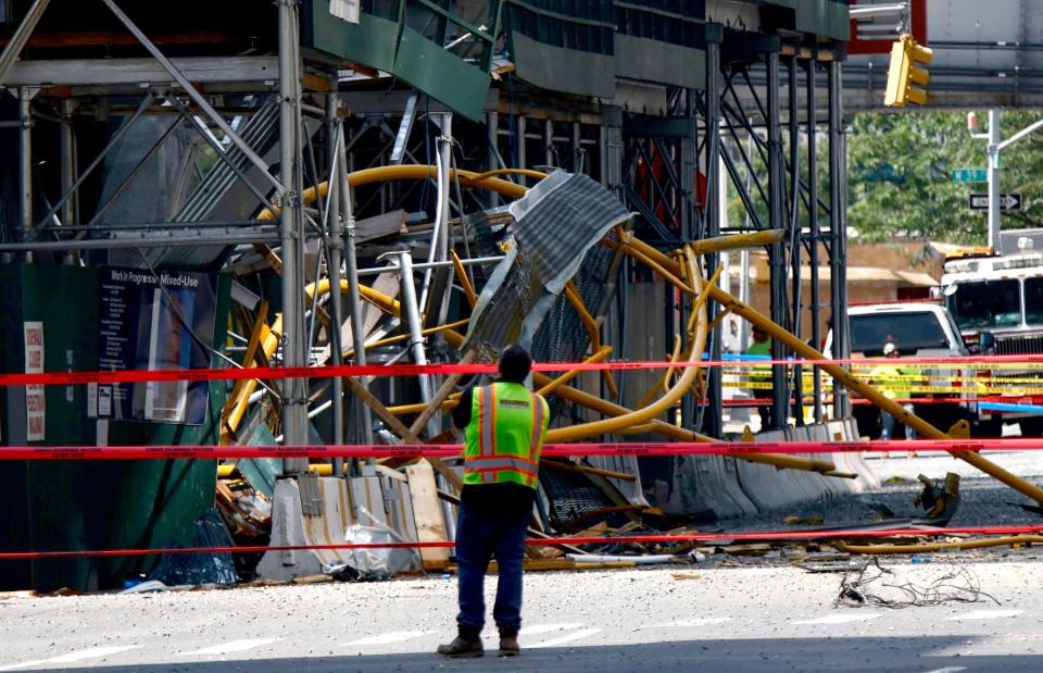 construction worker in a vest standing at the site