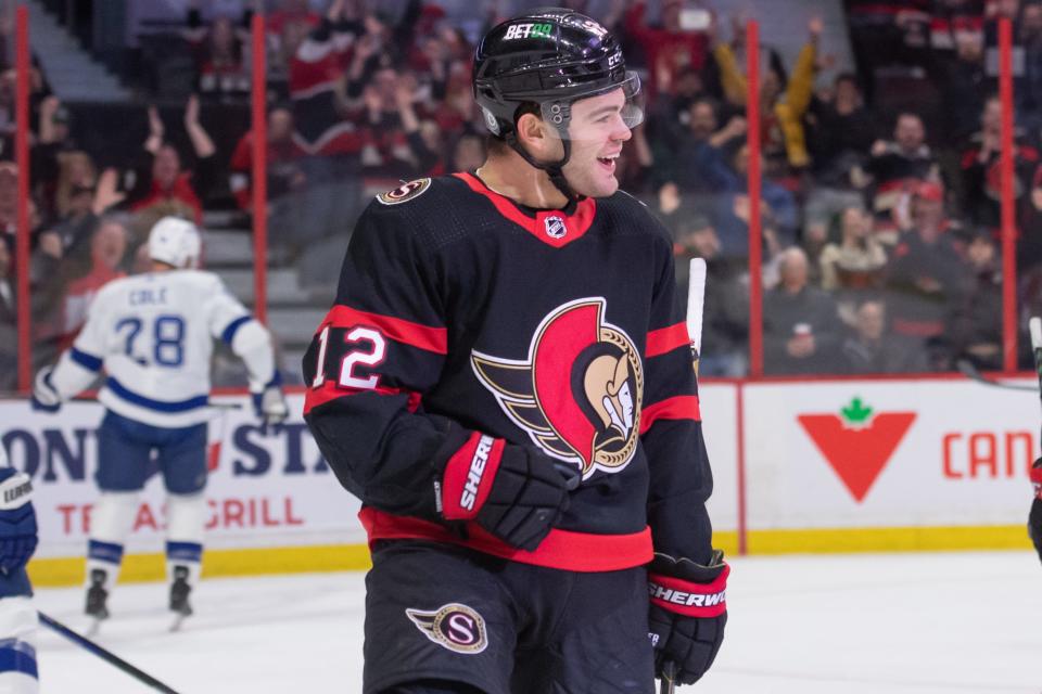 Mar 23, 2023;  Ottawa, Ontario, CAN;  Ottawa Senators right wing Alex DeBrincat (12) celebrates his goal scored in the first period against the Tampa Bay Lightning at the Canadian Tire Centre.