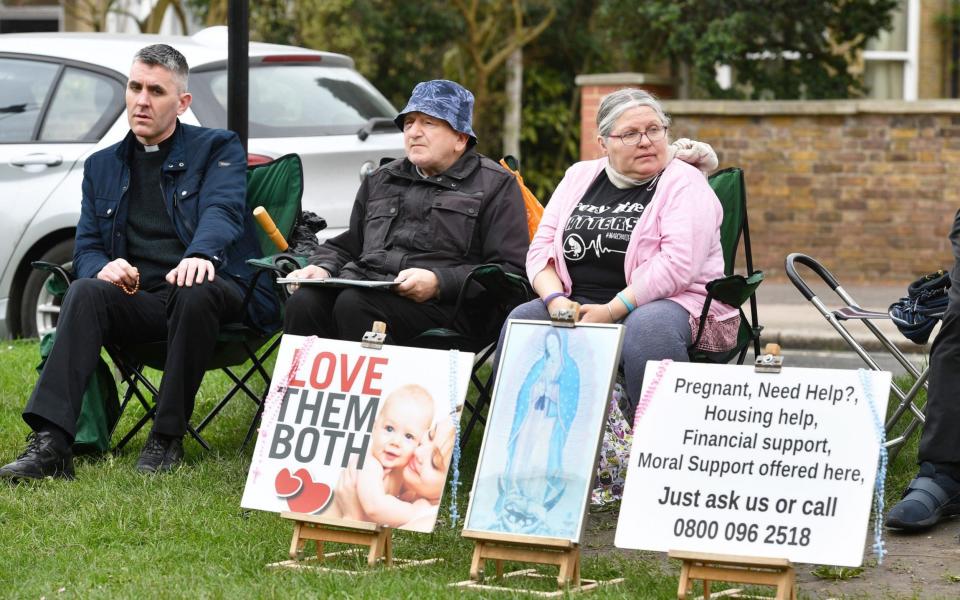 Protesters outside the Marie Stopes clinic in Ealing have been told they must stay 100m from the building - PA