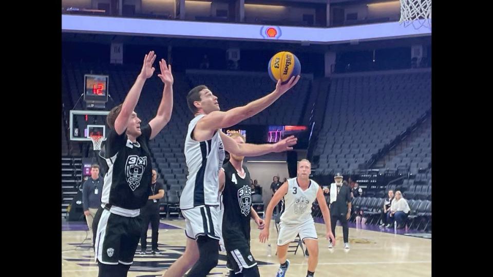 Jimmer Fredette of Team Miami, in the championship game, drives past Trey Bardsley of Team Omaha for the layup on Sunday, Oct. 1, 2023.