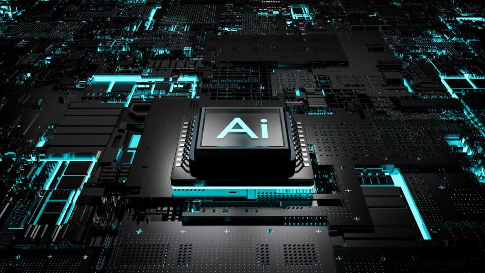 A digital rendering of a black chip inscribed with AI, sitting on a circuit board.