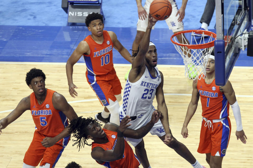 Kentucky's Isaiah Jackson (23) shoots near Florida defenders Omar Payne (5), Anthony Duruji (4),Noah Locke (10) and Tre Mann (1) during the second half of an NCAA college basketball game in Lexington, Ky., Saturday, Feb. 27, 2021. (AP Photo/James Crisp)