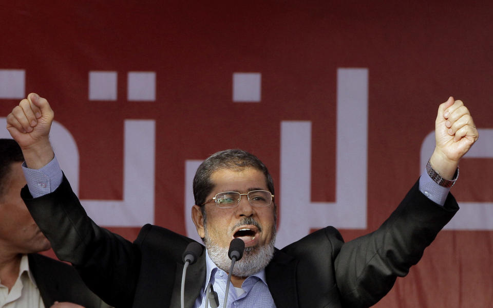 FILE - In this Friday, June 29, 2012 file photo, Egypt's President-elect Mohammed Morsi talks to his supporters at Tahrir Square, the focal point of Egyptian uprising, during his speech in Cairo, Egypt. Egyptian officials say security authorities leaked a recording of a private conversation between ousted President Mohammed Morsi and his lawyer on the sidelines of his trial, in which Morsi says protests by his supporters and the crackdown on them are "useless." (AP Photo/Amr Nabil, File)