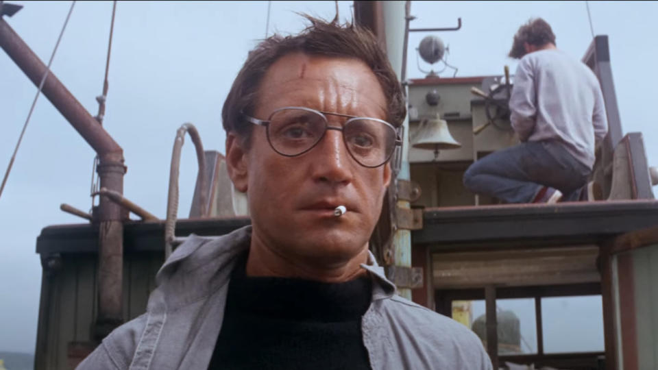 Roy Scheider stands stunned on the Orca's deck in Jaws.