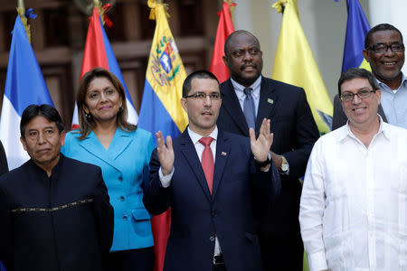 Venezuela's Foreign Minister Jorge Arreaza (C), former Bolivian Foreign Minister David Choquehuanca (L) and Cuba's Foreign Minister Bruno Rodriguez (R) pose for a picture during an ALBA-TCP alliance meeting in Caracas, Venezuela August 8, 2017. REUTERS/Ueslei Marcelino