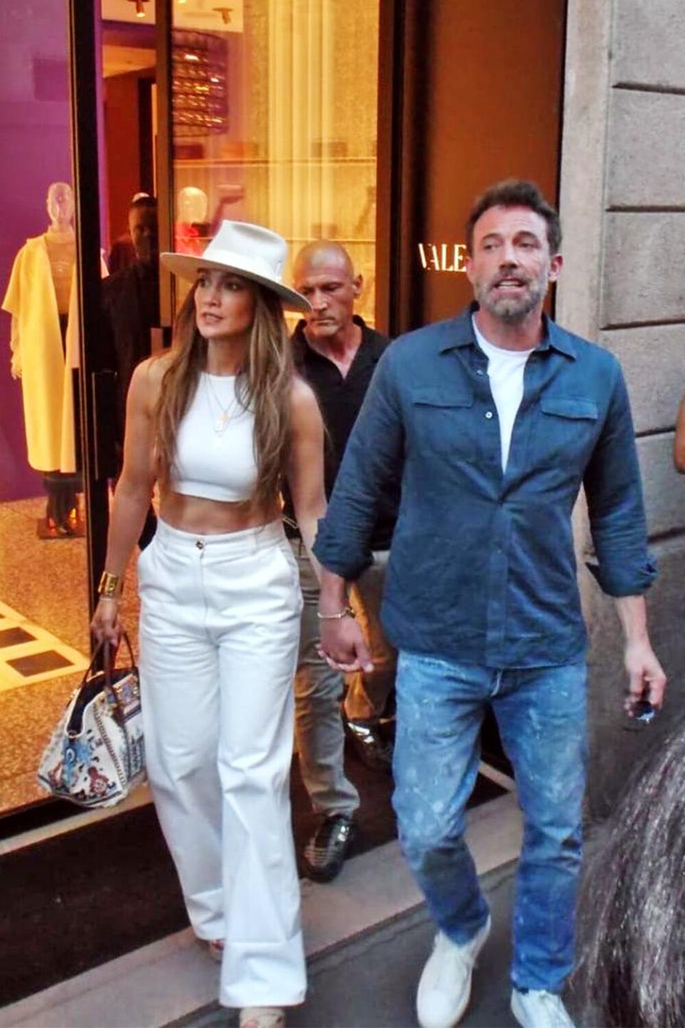 Mandatory Credit: Photo by Mimmo Carriero/ipa-agency.net/Shutterstock (13272159az) Jennifer Lopez and her husband Ben Affleck arrive by surprise in the late afternoon in the center to do some shopping. With some bodyguards who make room for them among the people they take a short walk, then visit some boutiques, the word of their presence spreads and the crowd becomes huge waiting for them outside Brunello Cuccinelli, so the bodyguards bring a car directly next to the boutique, and so with difficulty Jennifer and Ben Affleck manage to gain entrance to leave immediately. Jennifer Lopez and Ben Affleck arrive by surprise at Brunello Cucinelli, Milan, Italy - 25 Aug 2022