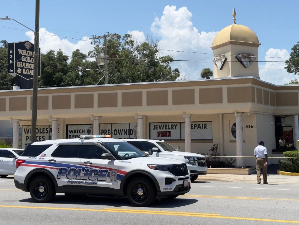 Daytona Beach Police Department Chief Jakari Young approaches crime scene tape at Volusia Gold & Diamond on International Speedway Boulevard on July 19, 2024. Police responded to reports of two people being shot at the business.