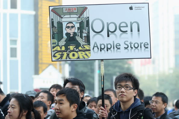 Chinese fans of Apple await the new Apple Store's opening. (Photo by Feng Li/Getty Images)