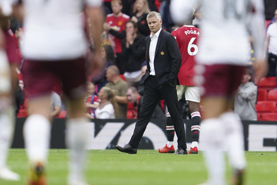 Manchester United's manager Ole Gunnar Solskjaer reacts at the end of the English Premier League soccer match between Manchester United and Aston Villa at the Old Trafford stadium in Manchester, England, Saturday, Sept 25, 2021. (AP Photo/Jon Super)