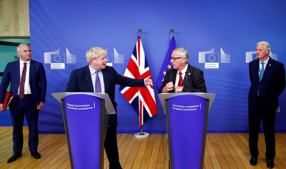 Britain's Prime Minister Boris Johnson, European Commission President Jean-Claude Juncker, European Union's chief Brexit negotiator Michel Barnier and Britain's Brexit Secretary Stephen Barclay attend a news conference after agreeing on the Brexit deal, at the sidelines of the European Union leaders summit, in Brussels, Belgium October 17, 2019. REUTERS/Francois Lenoir